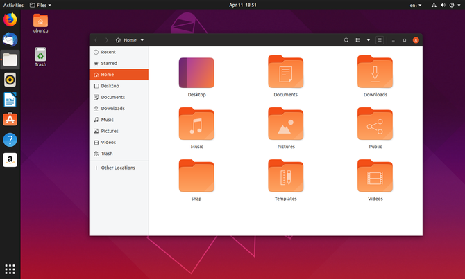 Správca súborov Ubuntu 19.04 s ikonami na pozadí